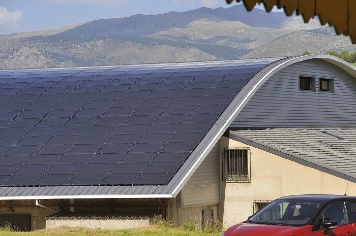 A curved roof with solar panels