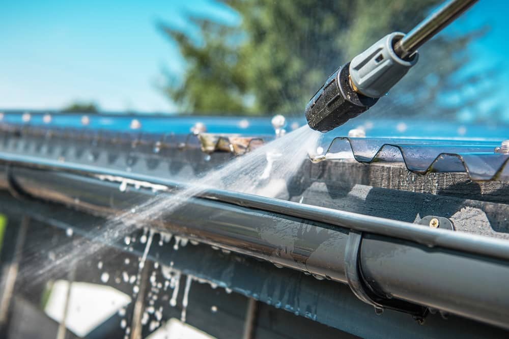 A pressure washer can help clean gutters