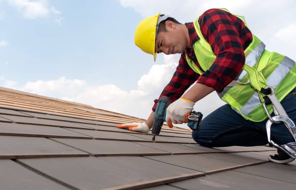 Wearing protective gear while working on your roof is a must. 