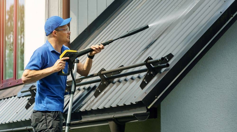 Cleaning metal roof.