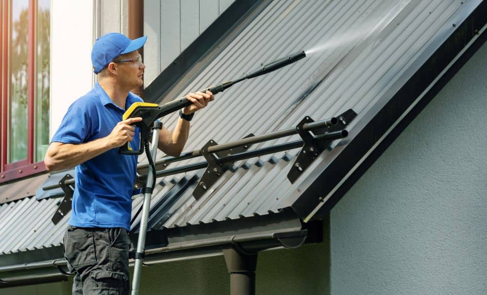 Cleaning metal roof.